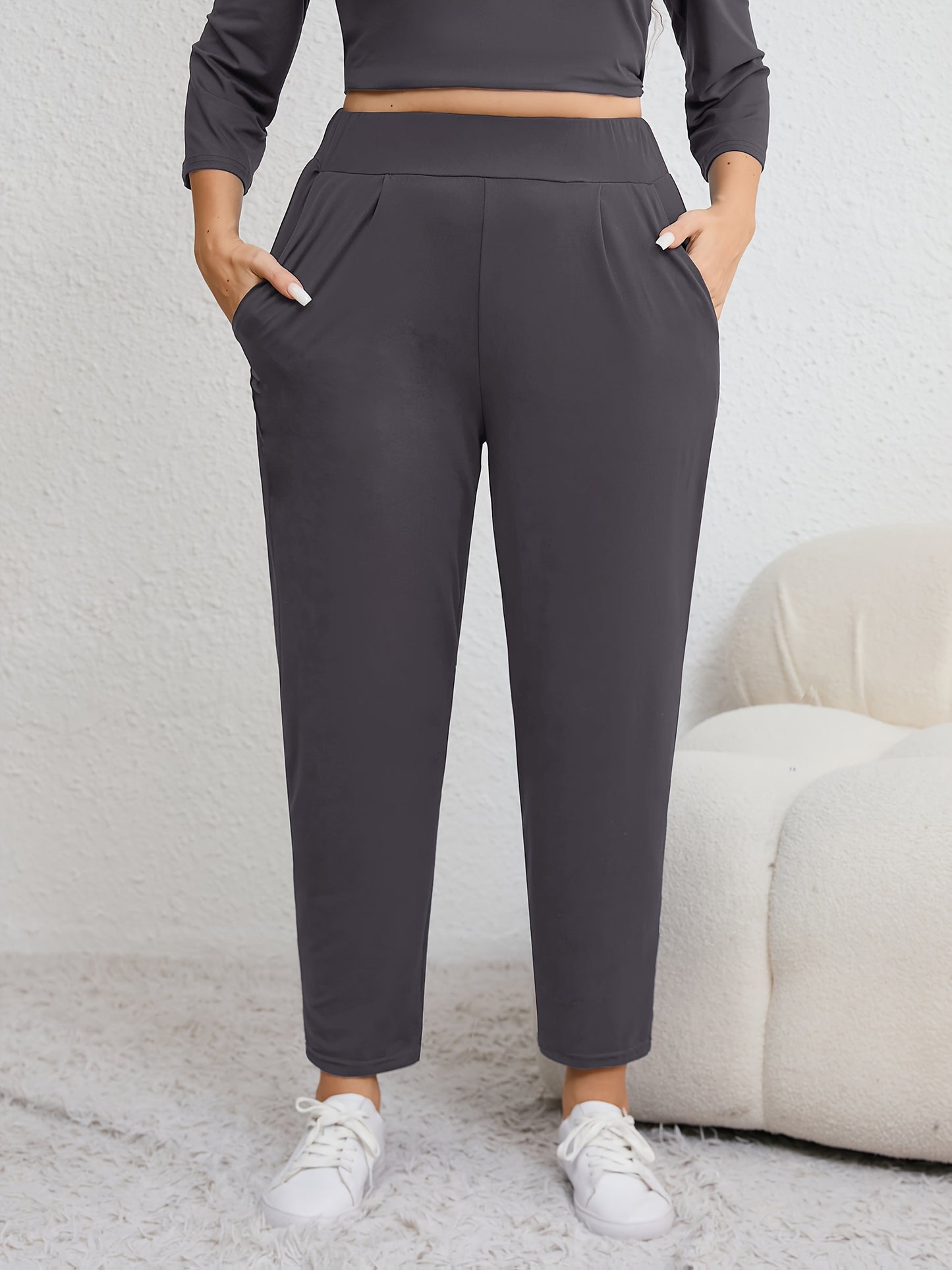 Plus size women's harem pants with high elasticity, ruched waist, pockets, and versatile for all seasons.