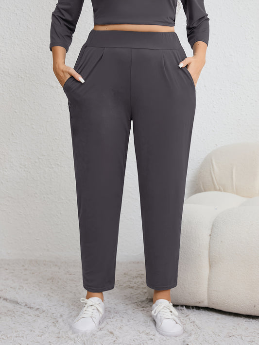 Plus size women's harem pants with high elasticity, ruched waist, pockets, and versatile for all seasons.