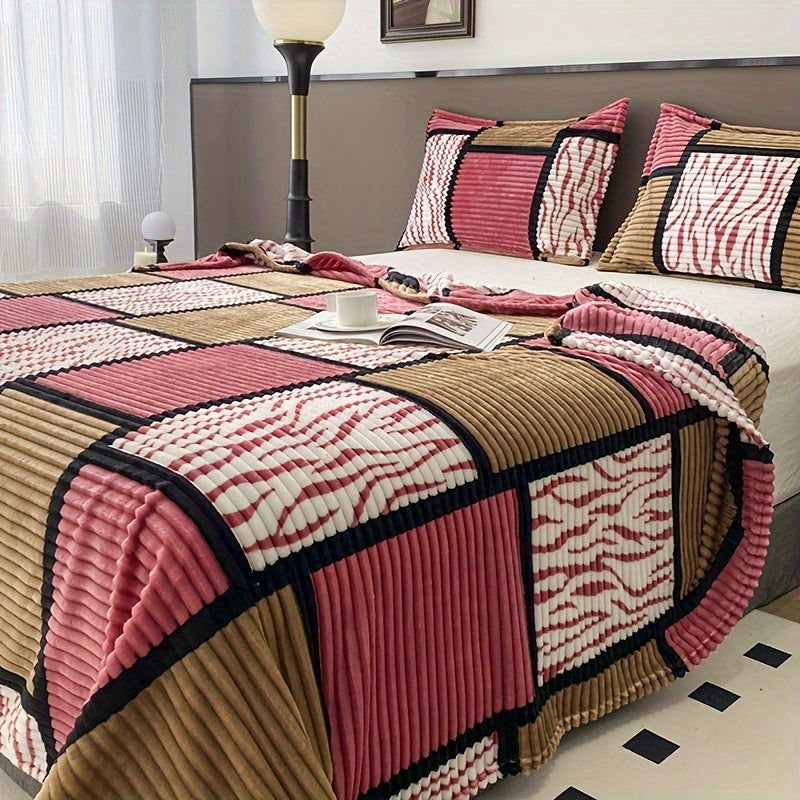 A plaid-patterned blanket that serves multiple functions in the home, including as a sofa throw.