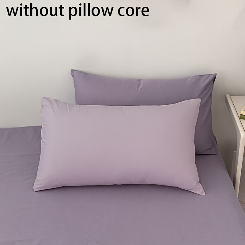 Get two ultra-soft brushed polyester pillowcases, weighing 90g each in a sleek light purple color. These rectangular pillowcases measure 50.8x76.2cm and feature an envelope closure. They are machine washable and perfect for adding cozy comfort to your