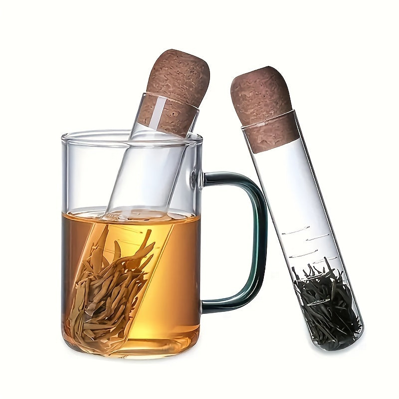 Glass tea infuser with cork lid that is easy to use and perfect for brewing loose leaf and herbal tea. Features a transparent test tube design, ideal for use in the office, camping, or home kitchen. A must-have tea accessory.