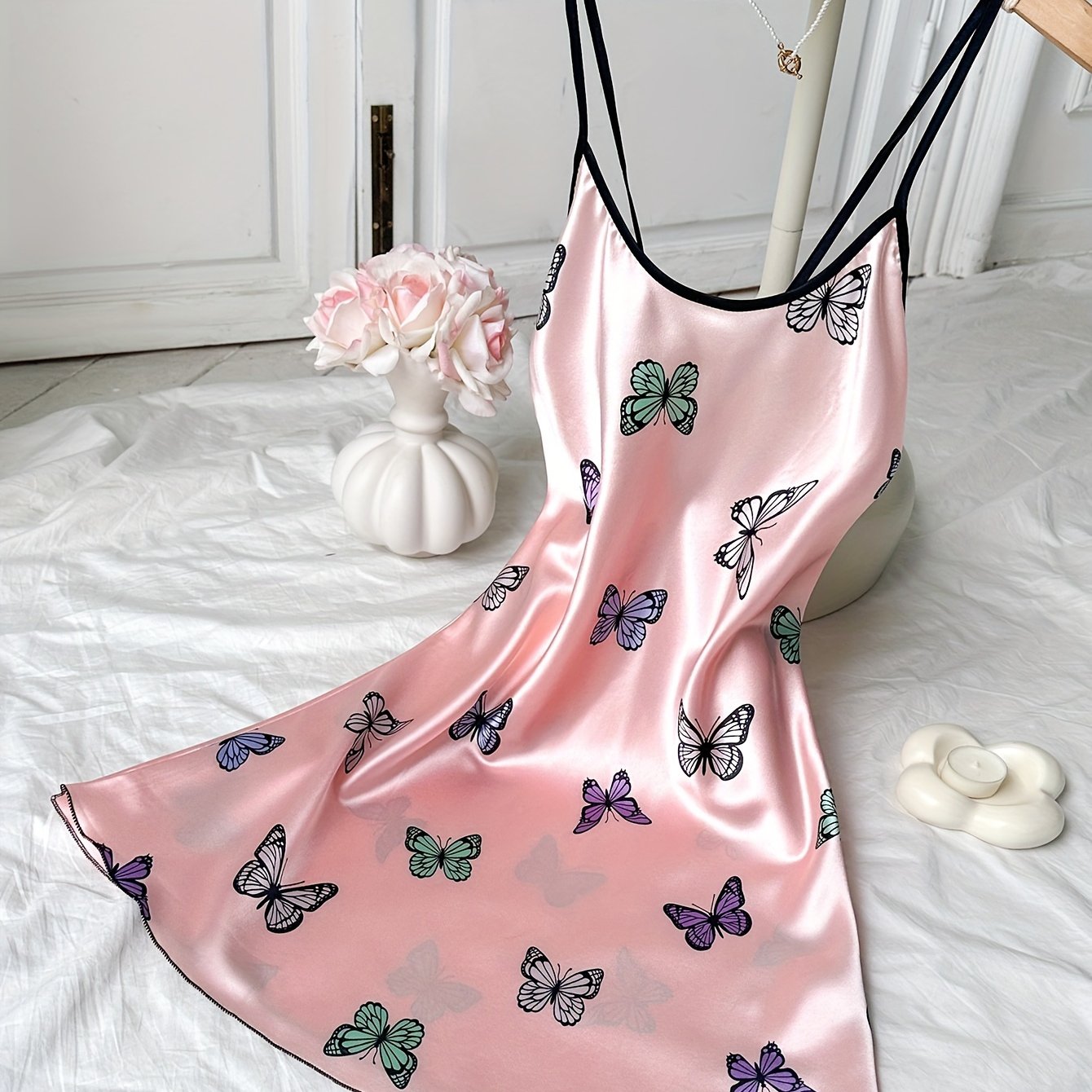 Satin nightgown with butterfly print and adjustable cross straps, perfect for women's sleepwear.