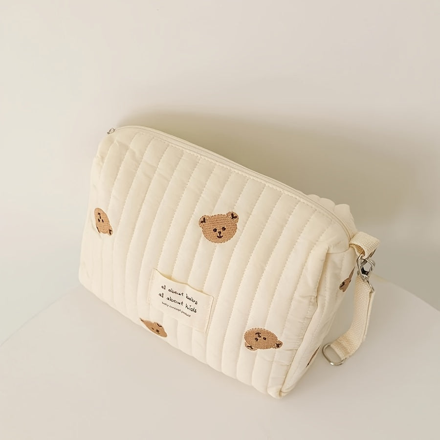 Stay organized on-the-go with this adorable Embroidered Diaper Clutch Bag designed for strollers. Made from durable polyester and featuring a quilted design, this pouch includes a secure zipper closure and cute floral embroidery. Perfect for ages 14 and