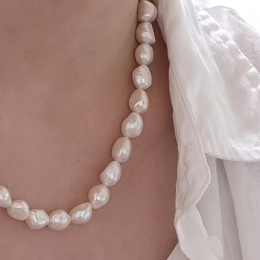 Beautiful French-inspired freshwater pearl necklace featuring distinctive gray baroque pearls, perfect for adding a touch of elegance to any outfit. Whether paired with casual attire or worn for a special occasion, this necklace is versatile and chic