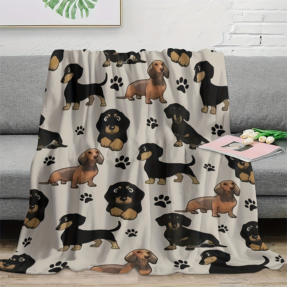 Soft and cozy Dachshund dog print fleece blanket perfect for pet lovers. This all-season throw is machine washable with a digital print design on a polyester cover and lining. Made with 200-250gsm knitted fabric in a contemporary style, this