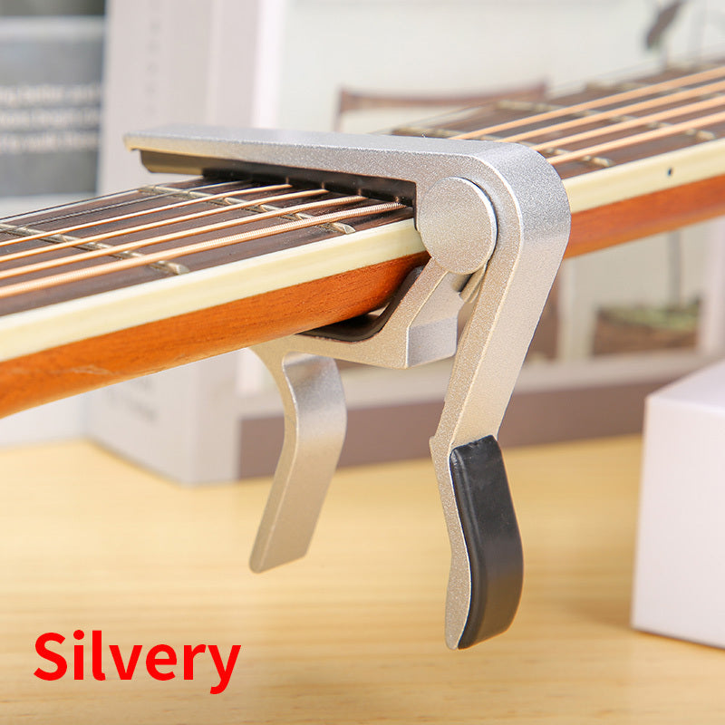 Aluminum alloy guitar capo for acoustic, classical, electric guitars and ukuleles, quick change with tone adjustment.