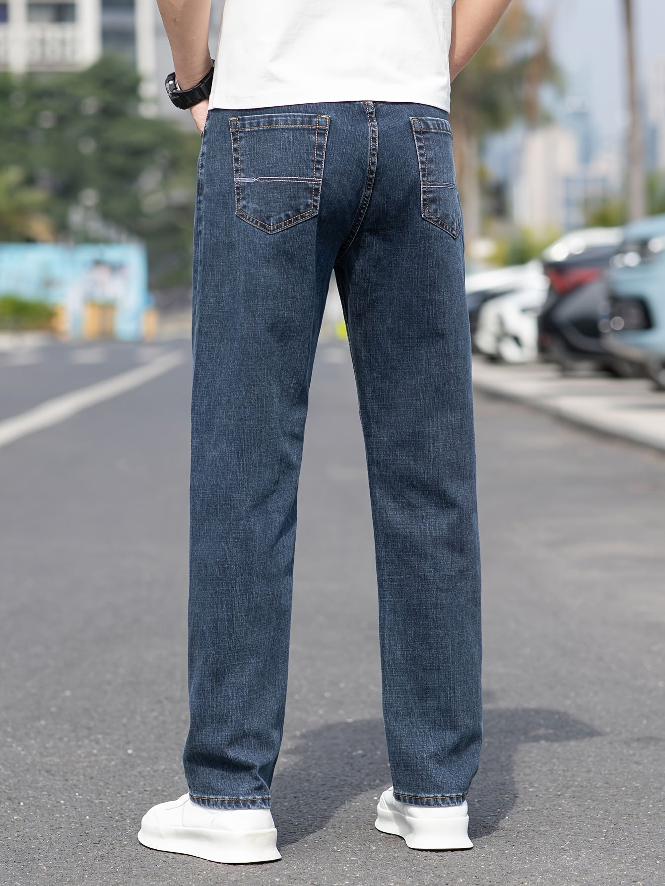 Solid loose denim trousers with pockets for men, made from breathable cotton blend. Perfect for outdoor activities.