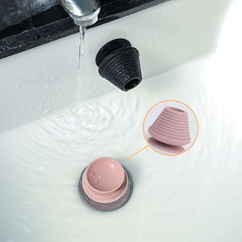 Universal silicone rubber plug with suction cup for kitchen, bathroom, and household drains.