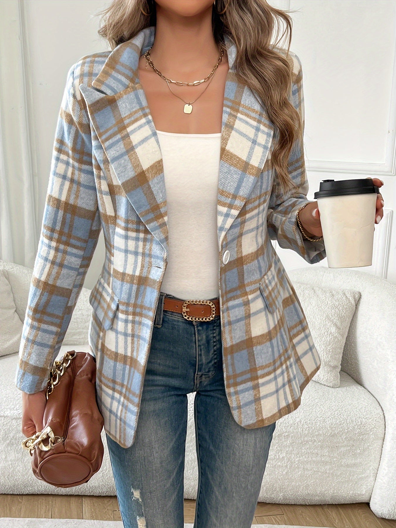 Classic plaid blazer with lapel and buttons, perfect for office and work attire.