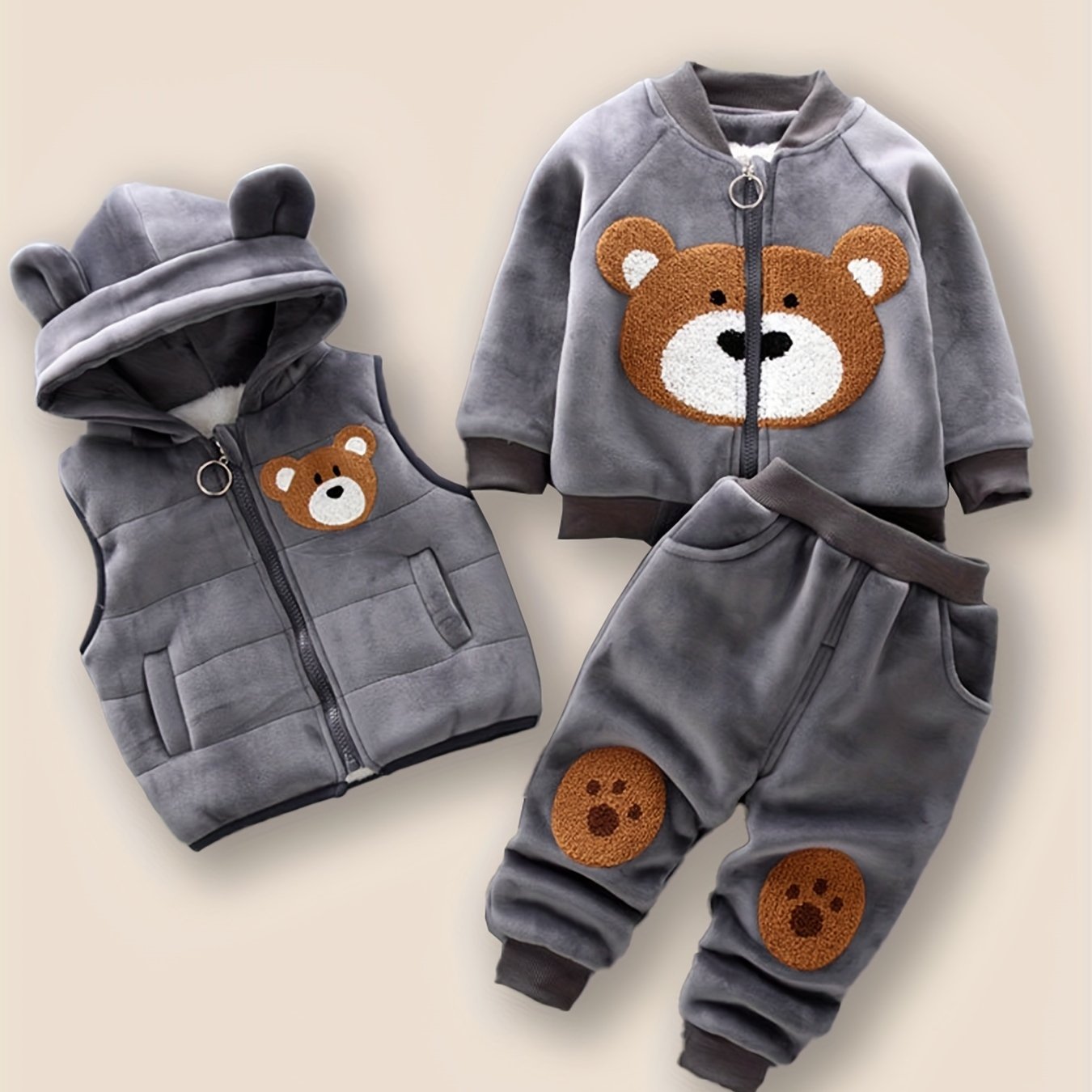 HIBOBI 3 piece toddler boy outfit set with bear appliqué top, hooded jacket, and pants made of 100% polyester with slight stretch. Regular fit for fall/winter and outdoor wear.