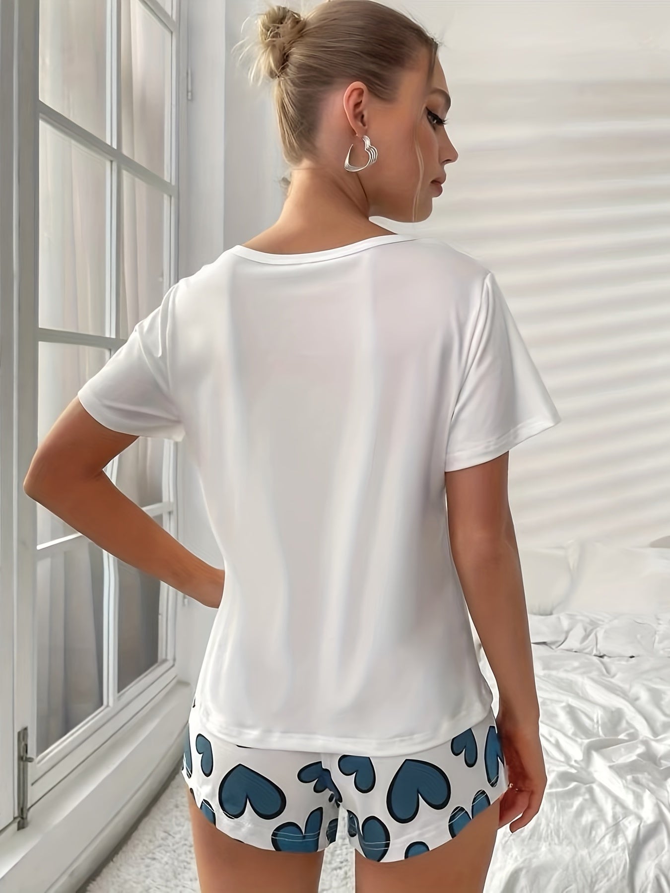 Women's Heart Print Pajama Set with Crew Neck Top and Elastic Waistband Shorts for Sleepwear and Loungewear.