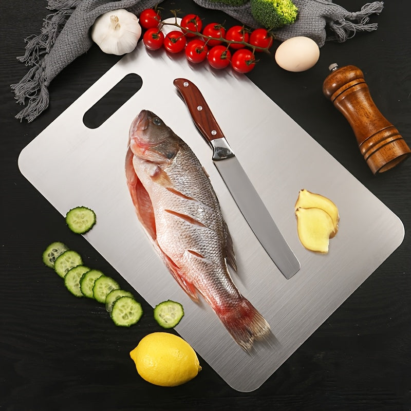 Durable Stainless Steel Cutting Board, with double-sided design, measuring 22.99 x 34.04 cm. This metal cutting board is food-safe, easy to clean, and suitable for cutting meat, vegetables, and fruits.