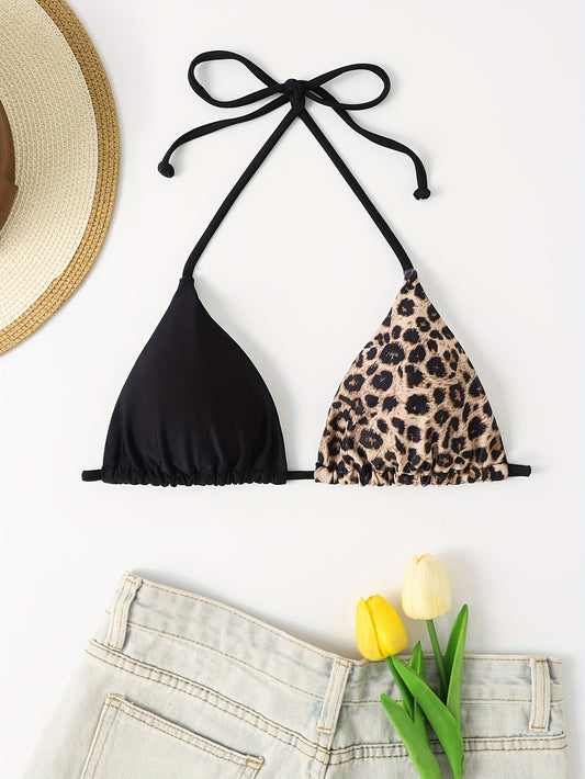 Two-tone triangle bikini top with leopard print and solid black color, adjustable tie back for poolside or beach fashion.