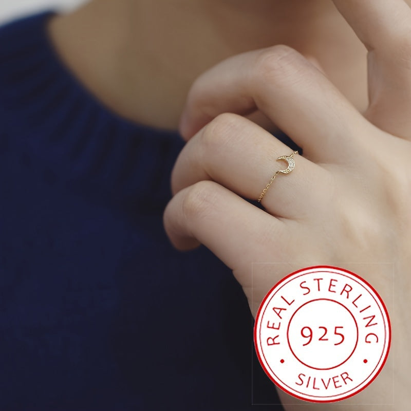 Adjustable open ring made of 925 sterling silver adorned with a moon and flower charm, perfect for women who love elegant and unique fashion jewelry. Weighing in at 2.3 grams, this stunning piece features a pull chain for easy adjustment and can be worn