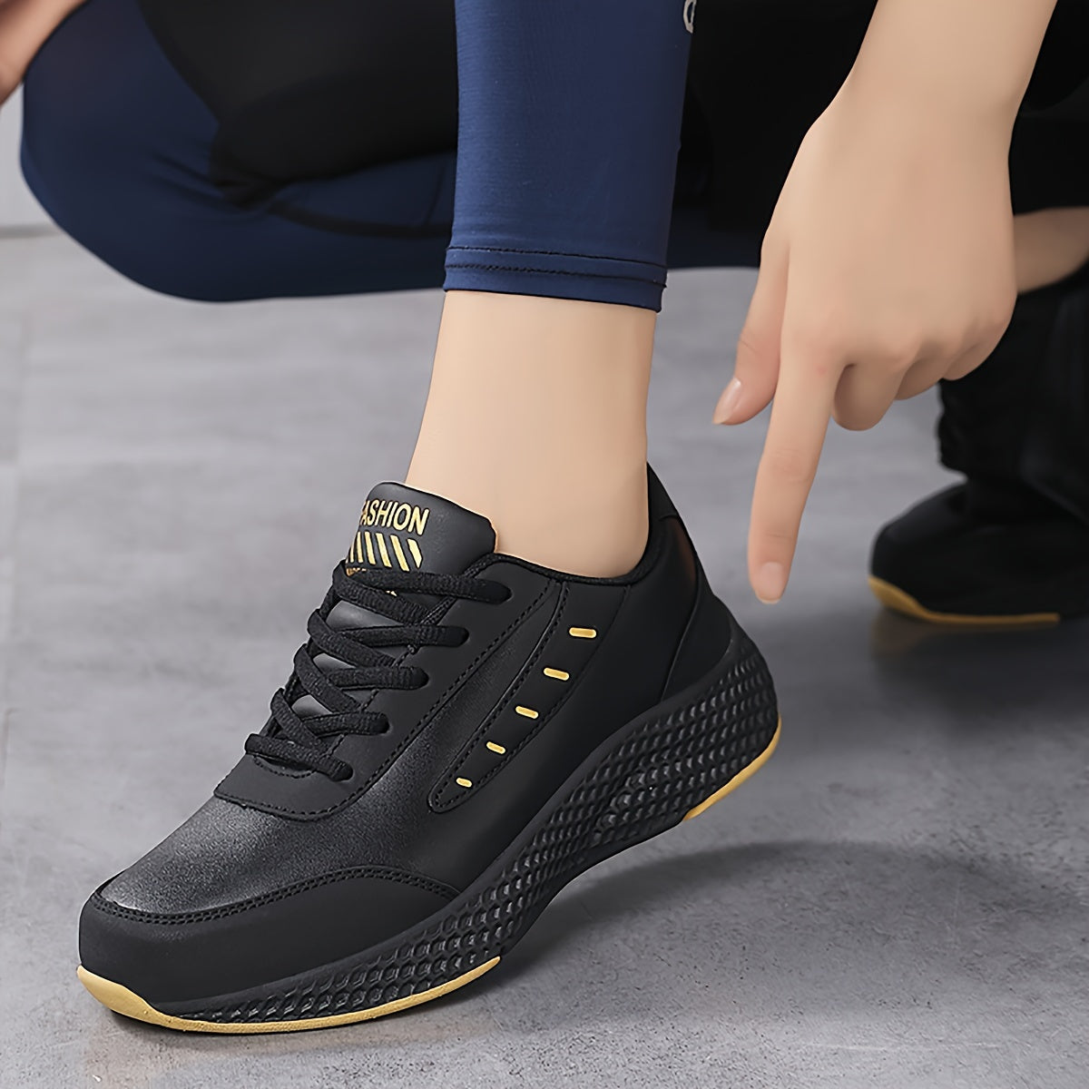 Black platform sneakers for women with lace-up design and comfortable fit, suitable for outdoor activities.