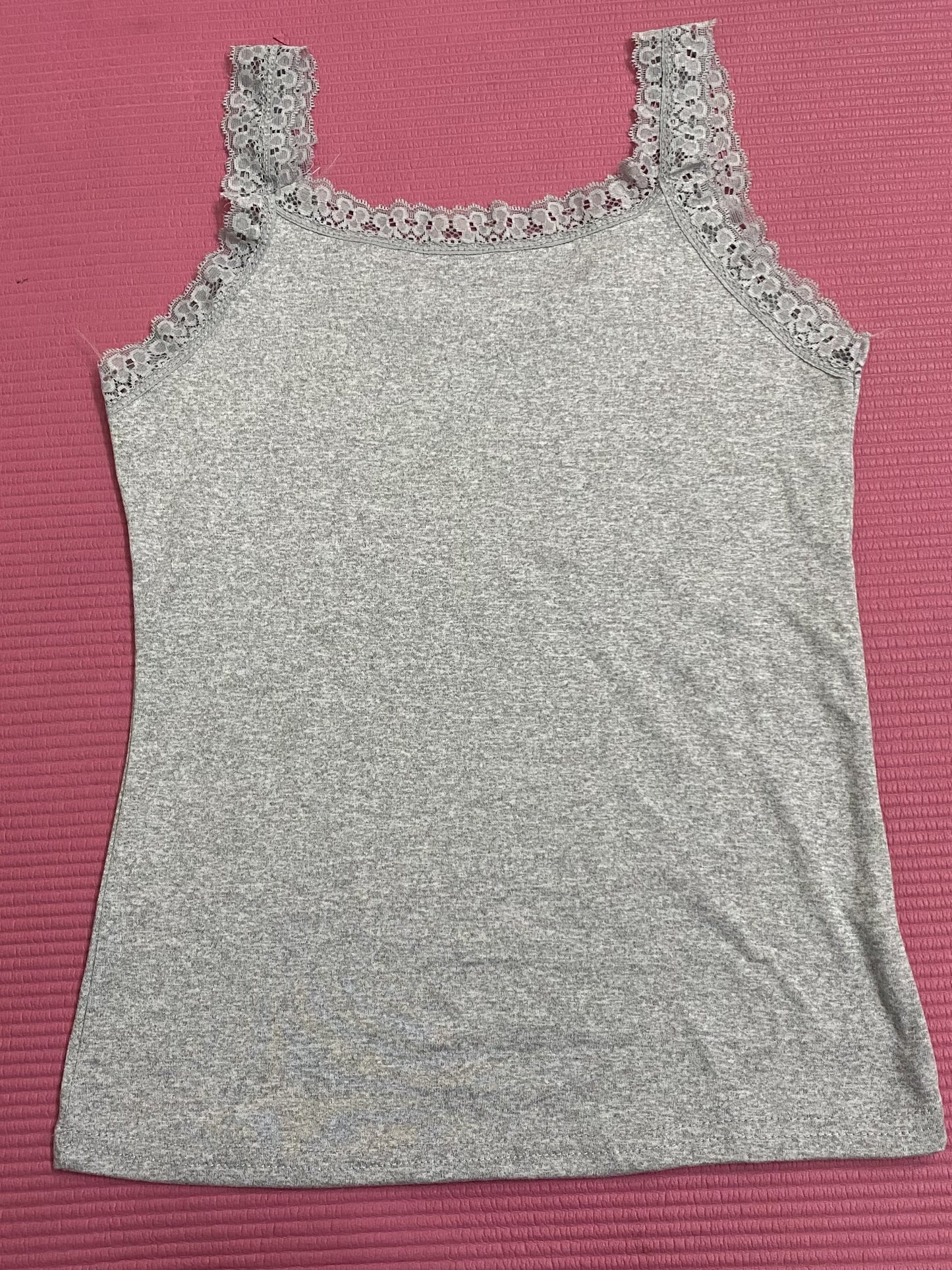 Three solid color women's tank tops with lace straps, including a versatile option for both inner and outer wear.