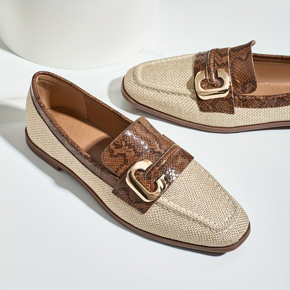 Women's brown snakeskin slip-on loafers with golden "C" buckle, lightweight sole, casual shoes.