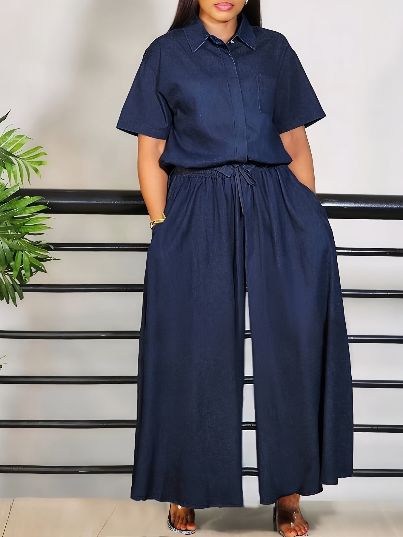 Casual short sleeve top and elastic waistband trousers set in solid color rayon blend, ideal for spring and fall. Features pockets and offers comfort.