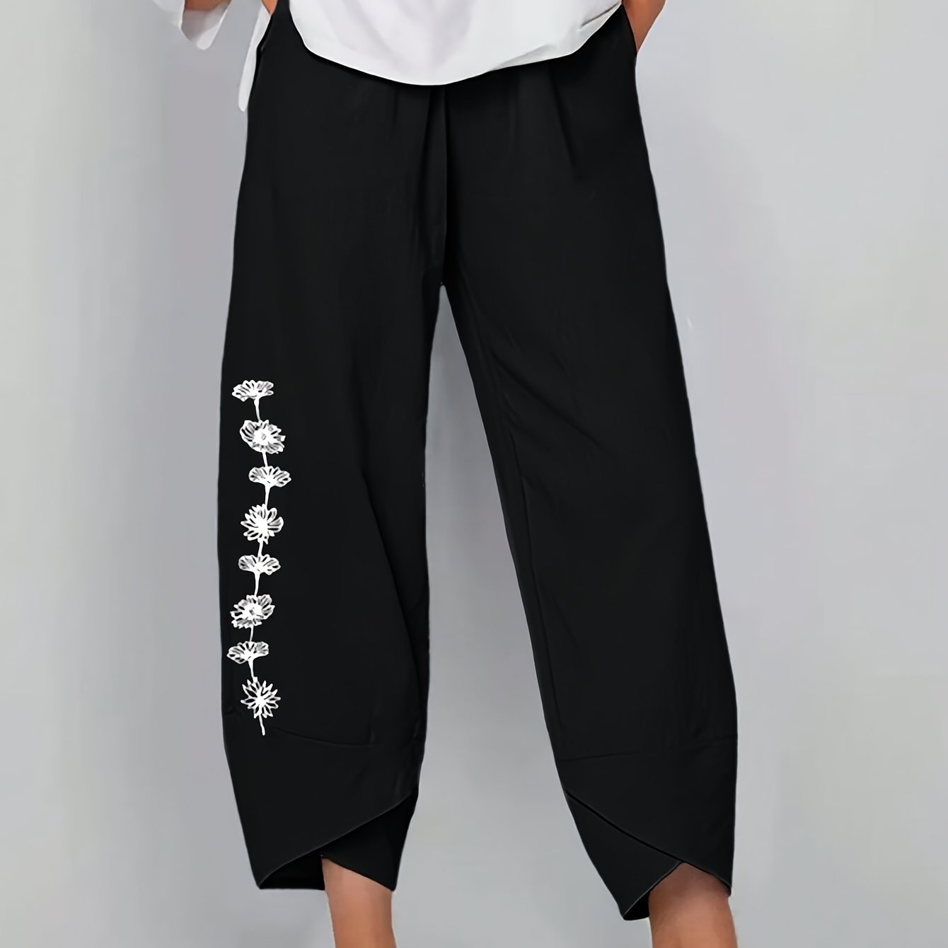 Baggy pants with dandelion print for plus size women, suitable for spring and fall.