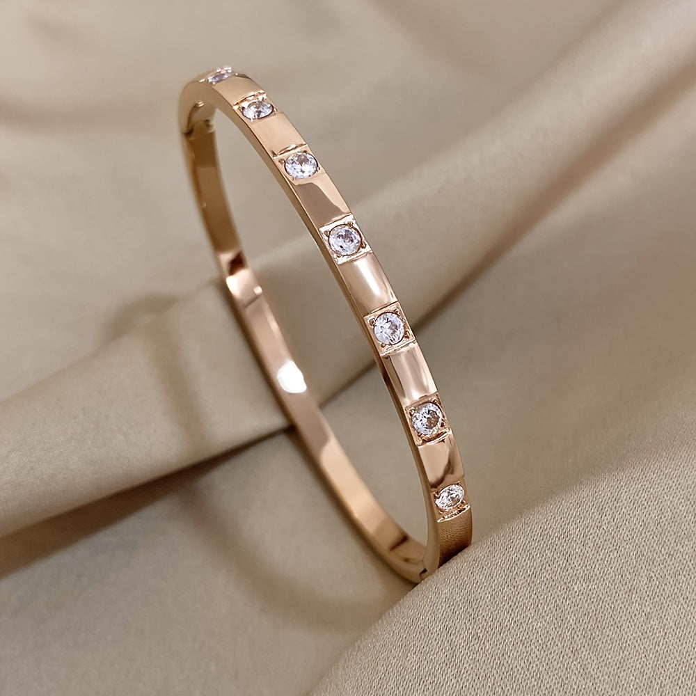 This exquisite rose gold stainless steel bracelet with sparkling rhinestones makes a stunning and opulent gift for your family, loved ones, and friends.