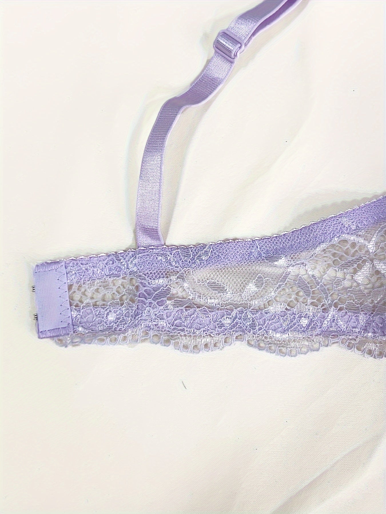 Medium support lace bra and panty set with contrast lace detail, made of 85% polyamide, 7% polyester, 5% elastane, and 3% viscose. Features drop waist briefs and chest pad.