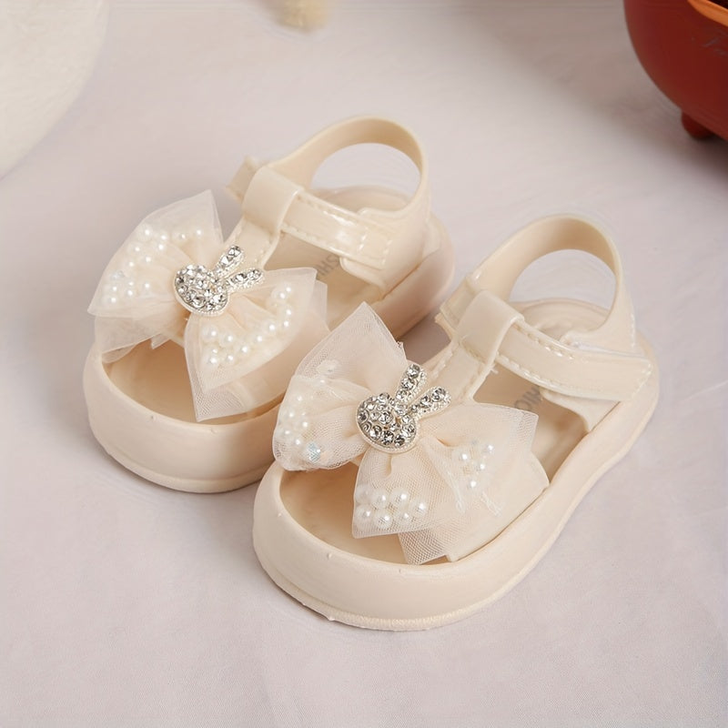 New 2024 baby girl sandals with anti-kick feature, cute rabbit design, and soft soles for beach.