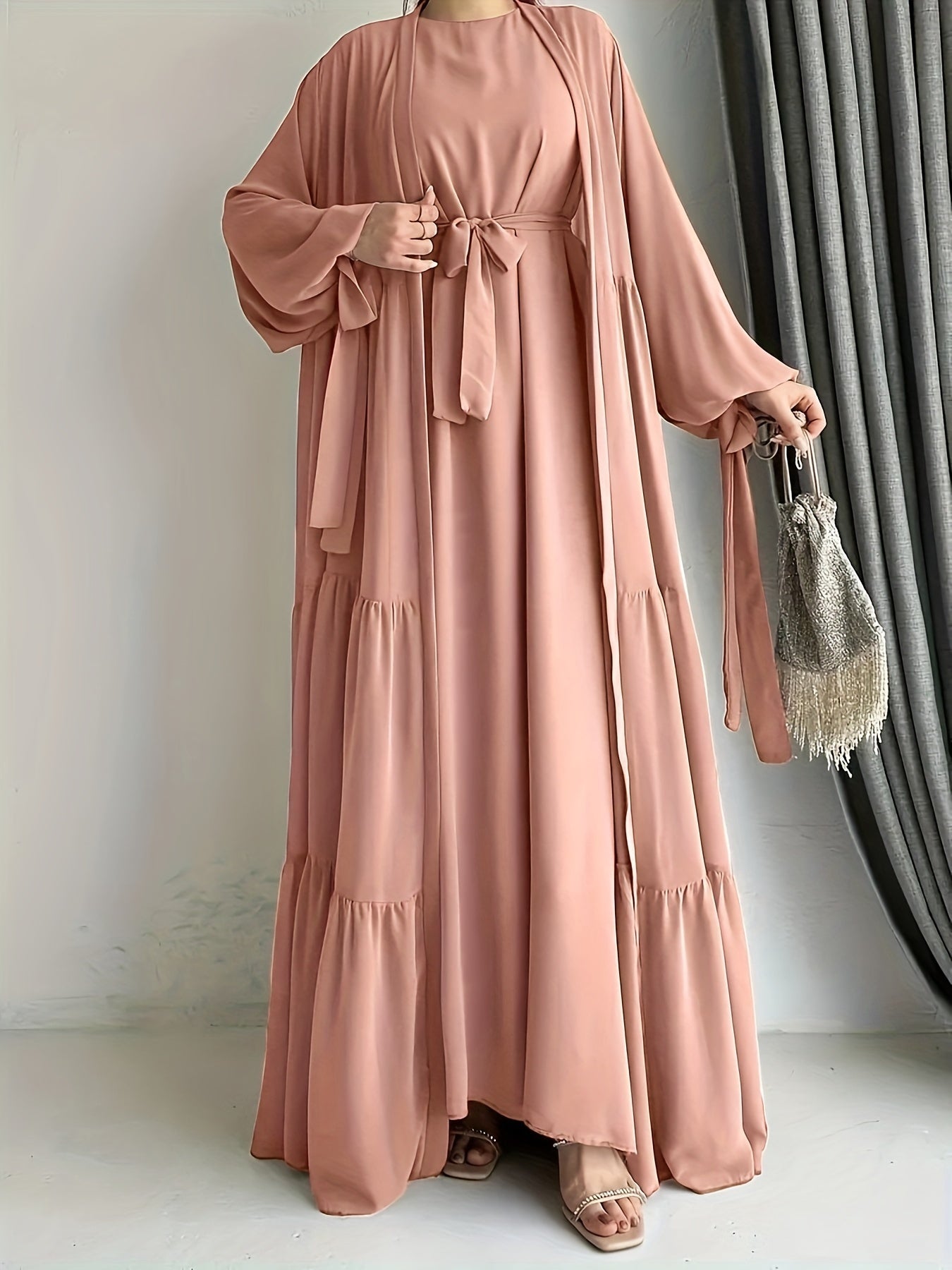 A stylish Middle Eastern Abaya set with vest and belt, featuring a chiffon H-Line robe with side split, lantern sleeves, and ruffle hem detail - perfect for all seasons.