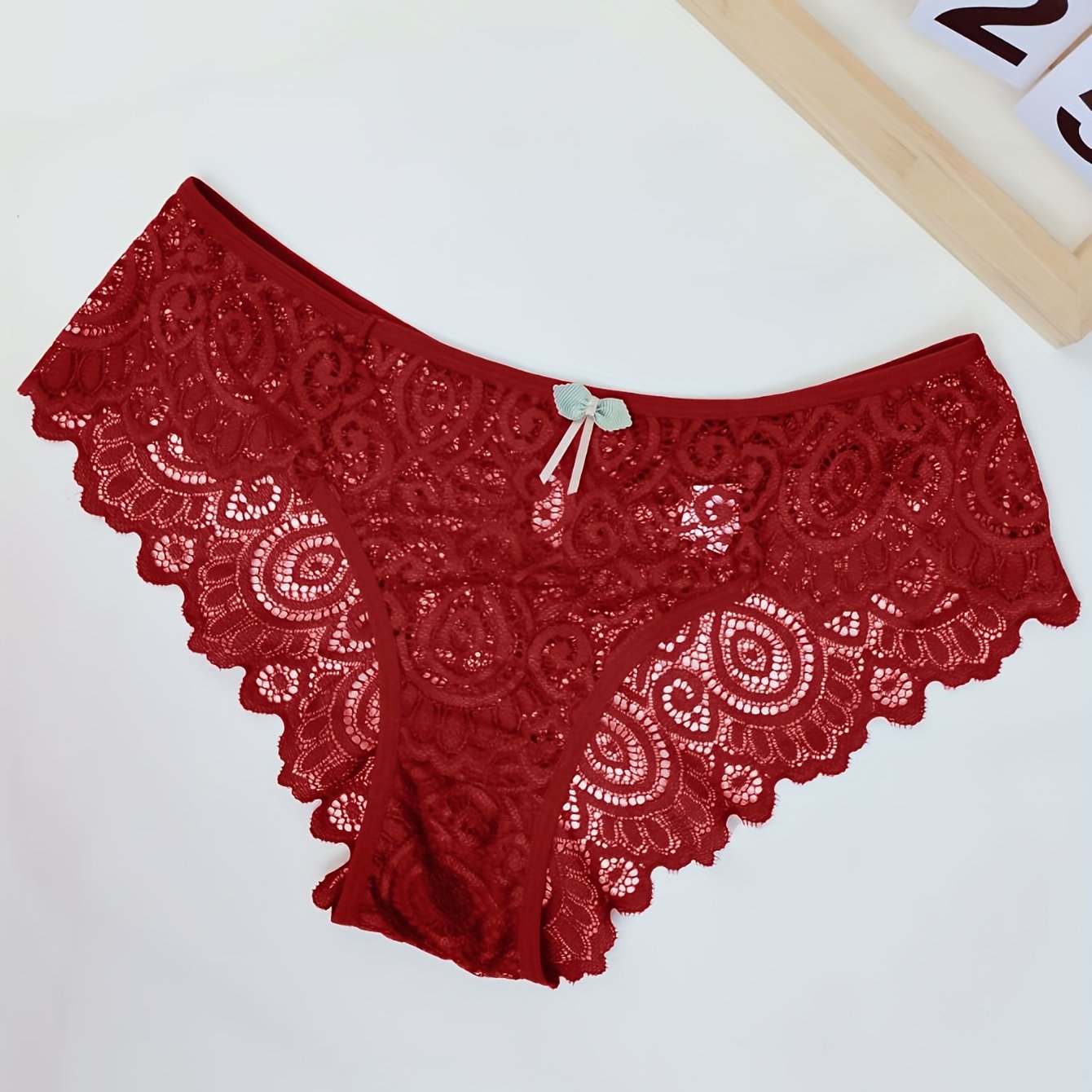 Women's low waist panties made of floral lace with cut outs, breathable and semi-sheer.