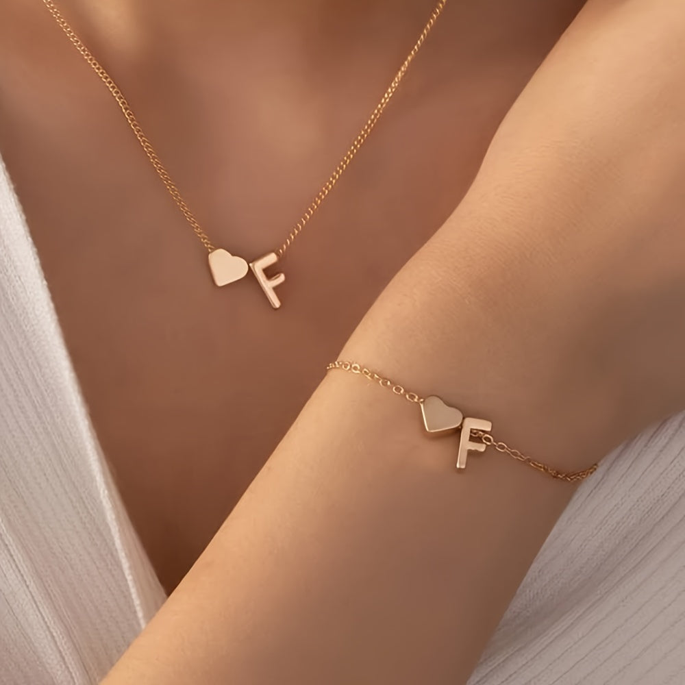 Chic two-piece set with metal heart and letter necklace and bracelet, ideal for daily wear.