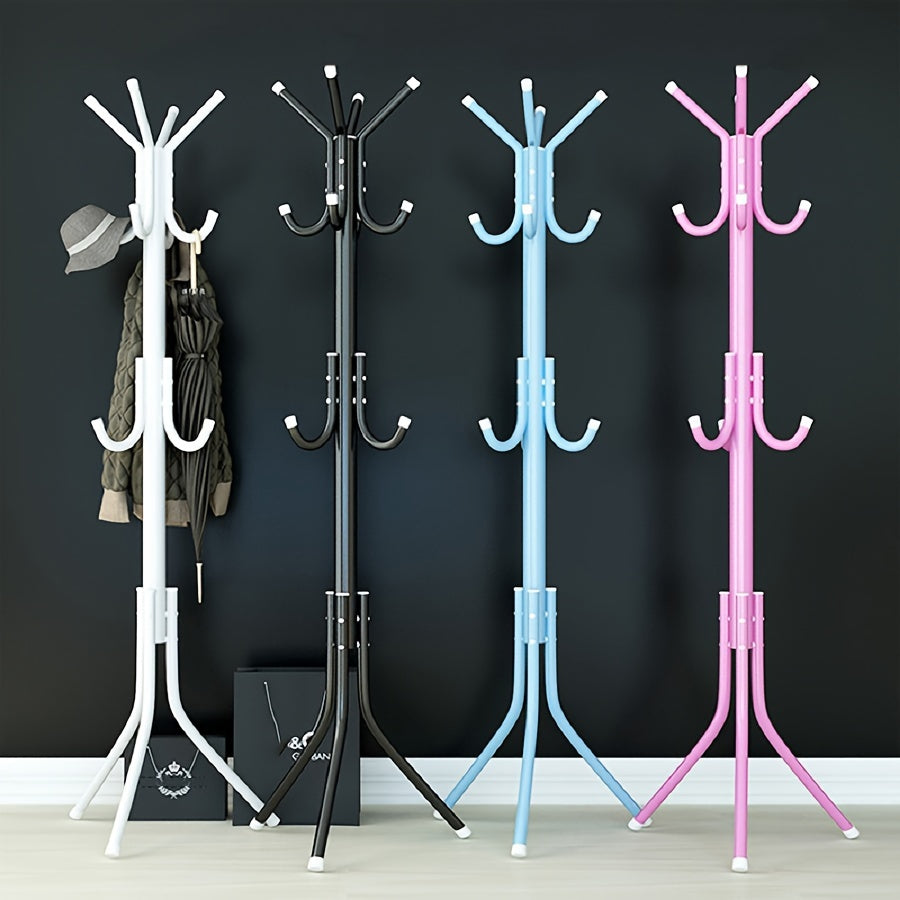 Multi-purpose, freestanding black metal coat rack with tree-style design for hanging clothes and hats in the bedroom.