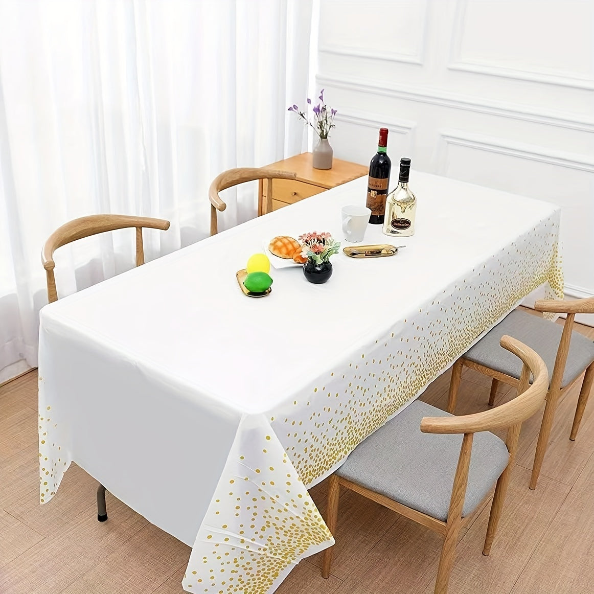 Disposable golden dot waterproof tablecloth, 137x274cm, for parties and events.