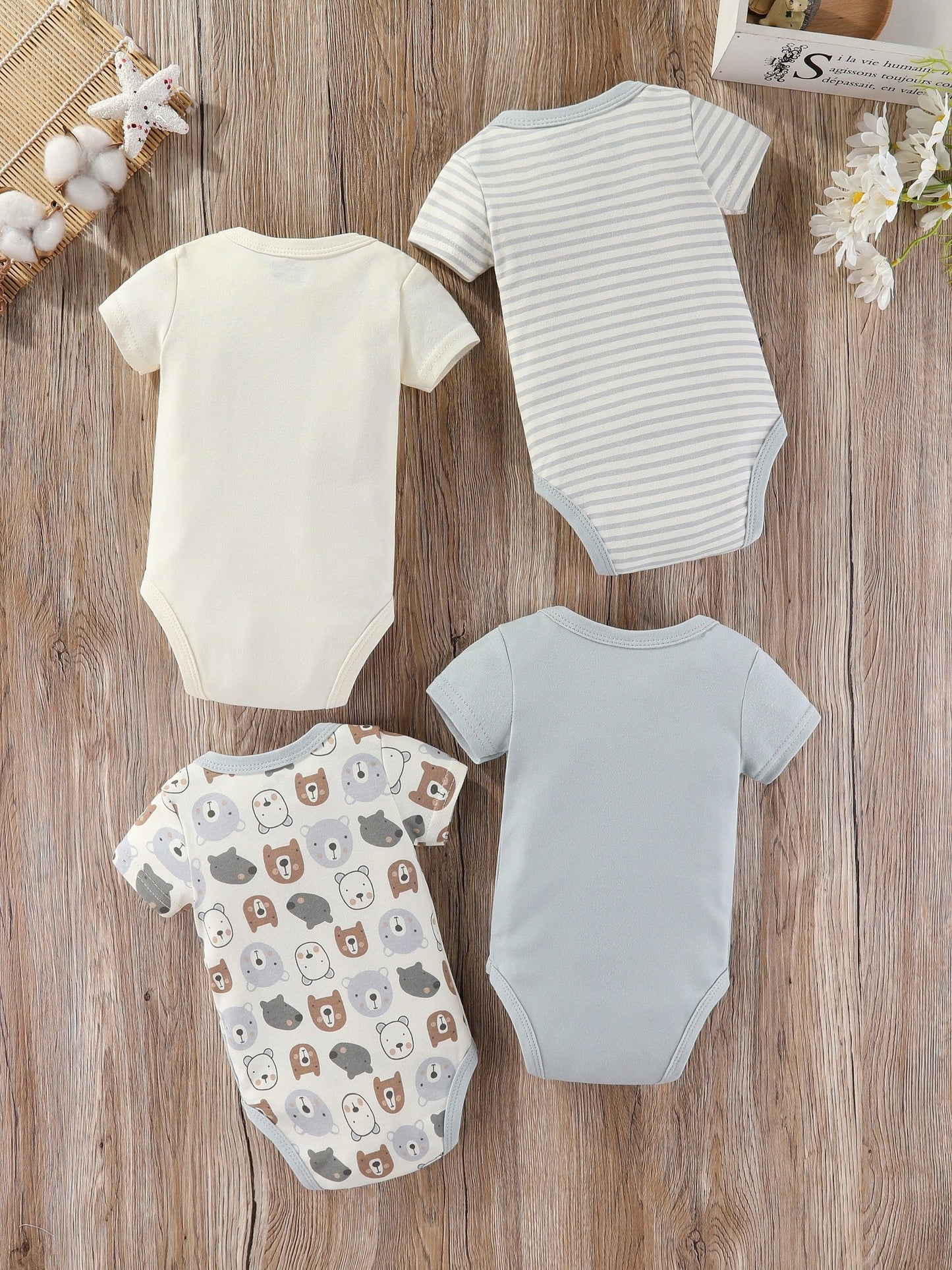 Baby boy's short sleeved cotton jumpsuit featuring plain color, stripes, bear embroidery, and bear heads print. Soft, breathable, and perfect for summer daily and outdoor wear.