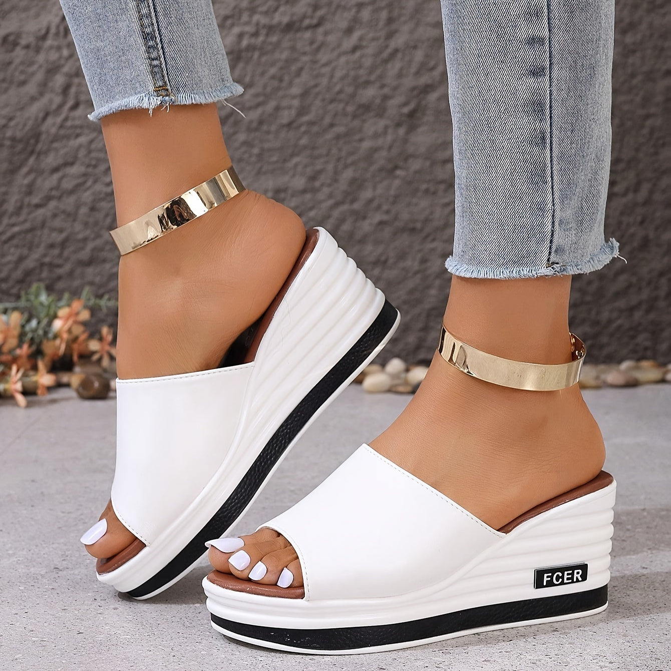 Women's white wedge sandals with a golden ankle accent and thick sole, perfect for casual summer wear.