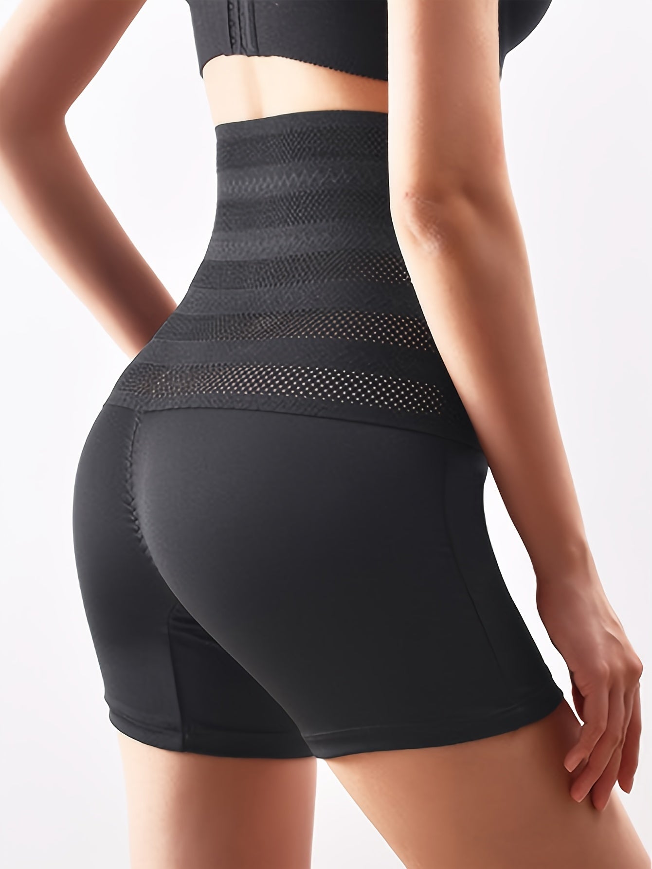 Solid color seamless shaping control panty with high waist for tummy tuck and butt lift.