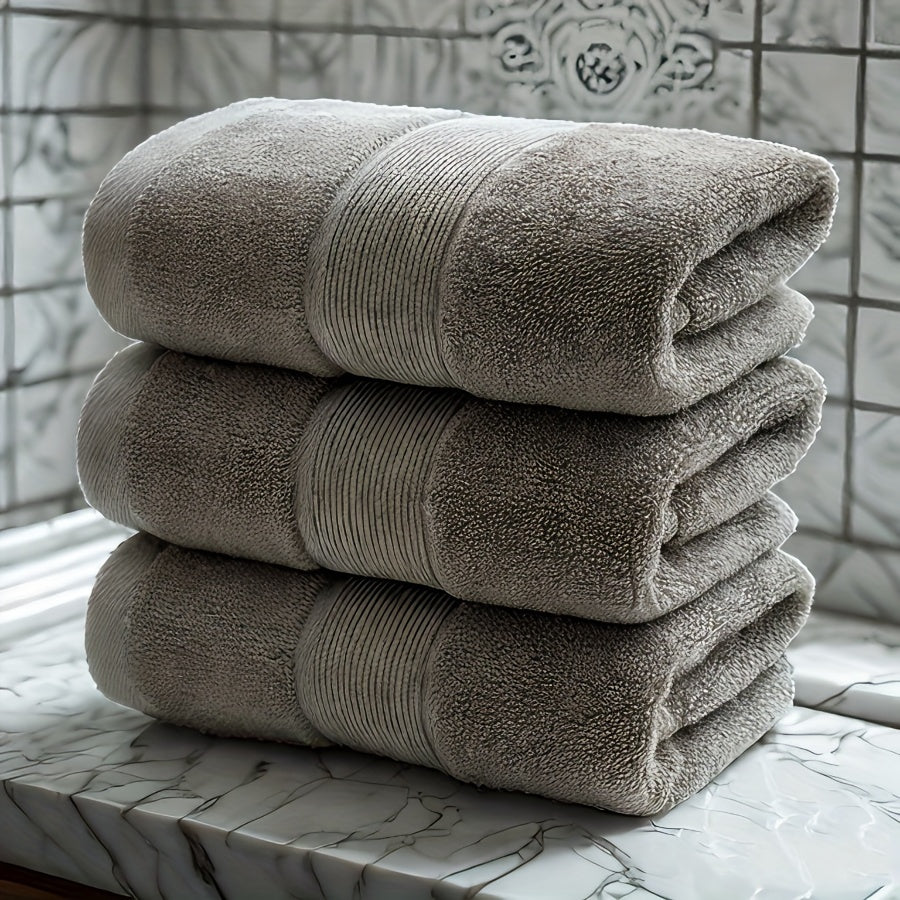 3 premium cotton velvet towels, 35.56cm x 73.66cm, soft & absorbent, hotel quality in dark blue, light beige, and gray. Ideal for bathroom or spa use.