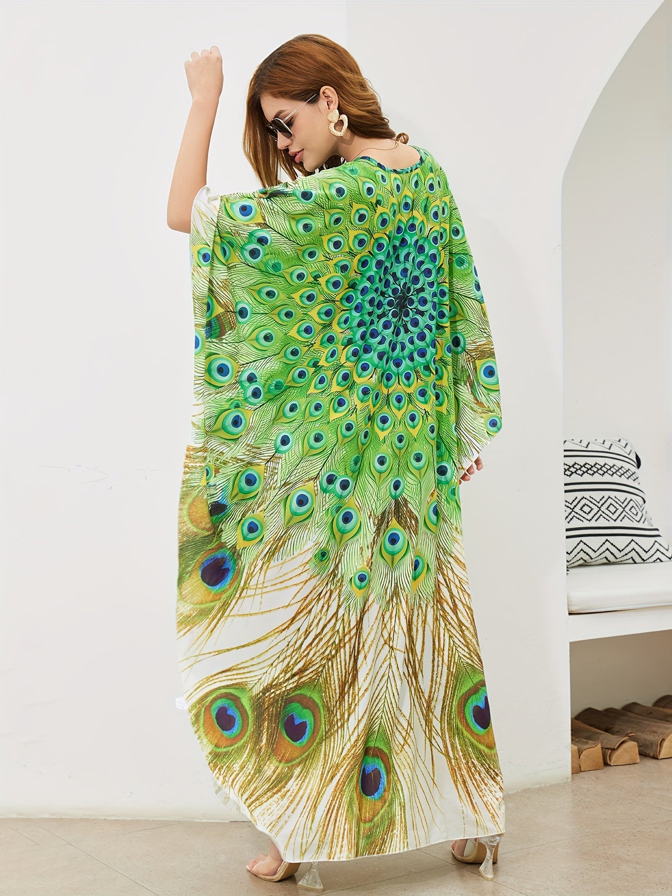 Handmade V-neck maxi beach dress in vibrant green, yellow, and blue peacock print, perfect cover-up for swimwear.