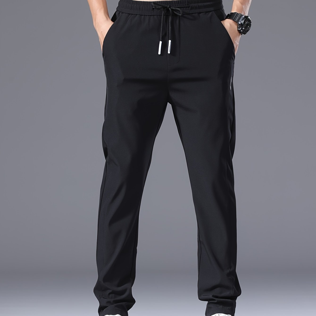 Men's slim fit drawstring sports pants, lightweight quick-dry trousers for summer leisure wear.