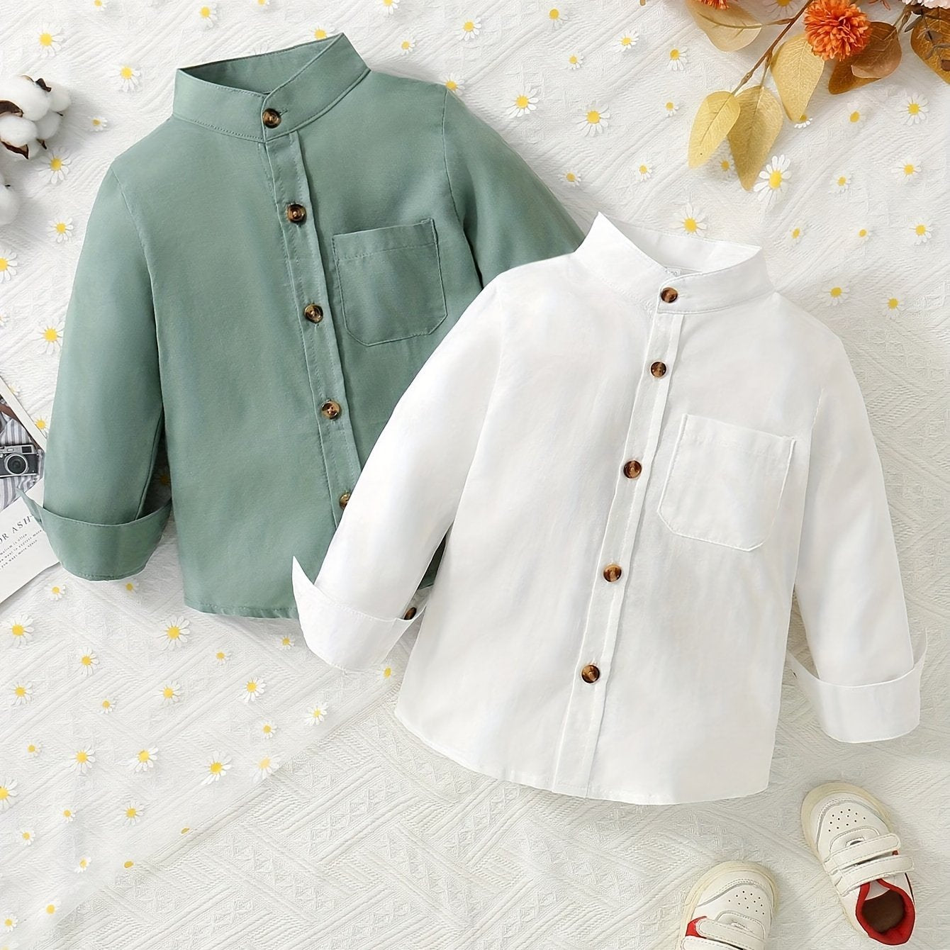 2 boys solid color stand collar shirts with long sleeves and button-up design, suitable for spring and fall wear.