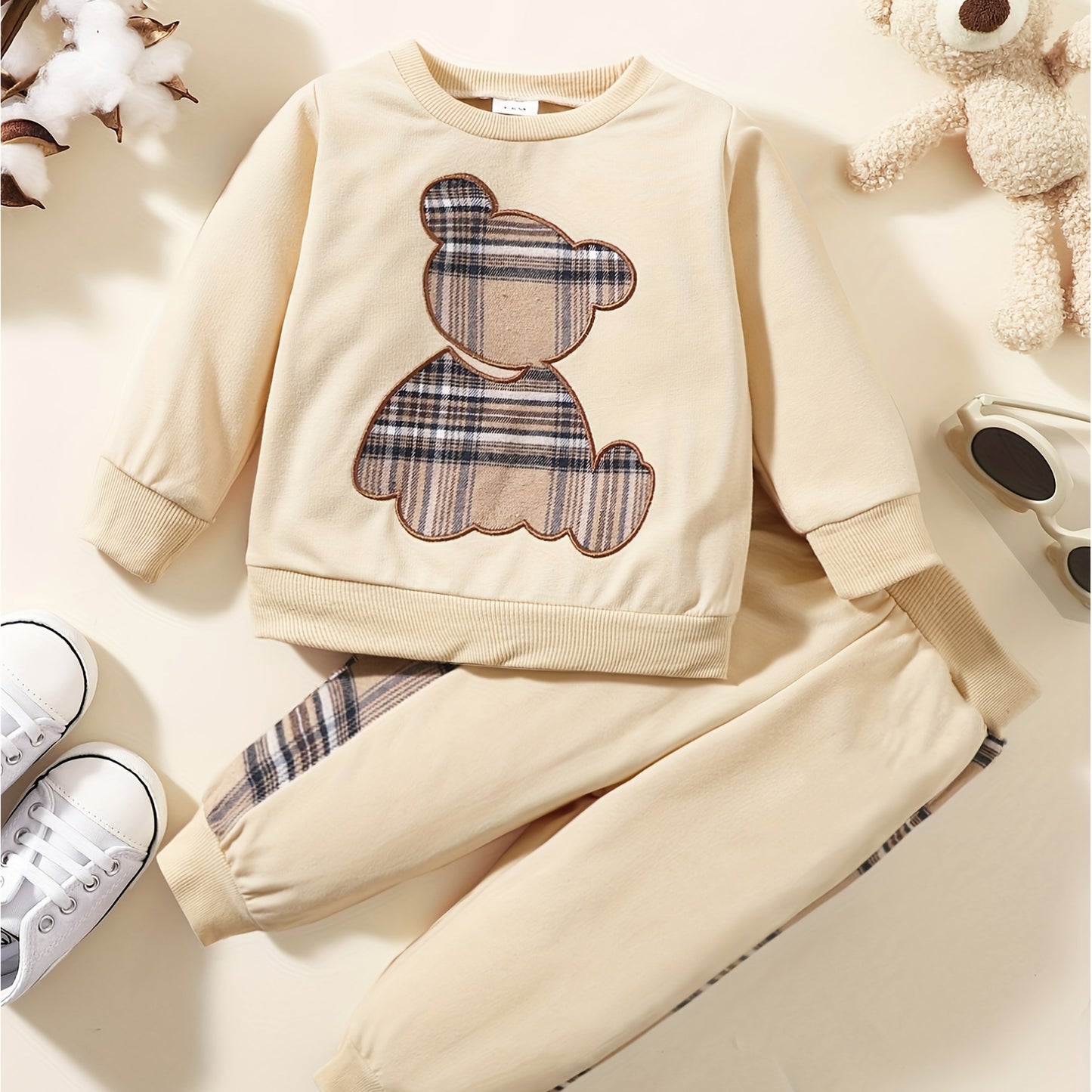 Toddler boy's outdoor fall/winter outfit with long sleeve sweatshirt and casual pants.