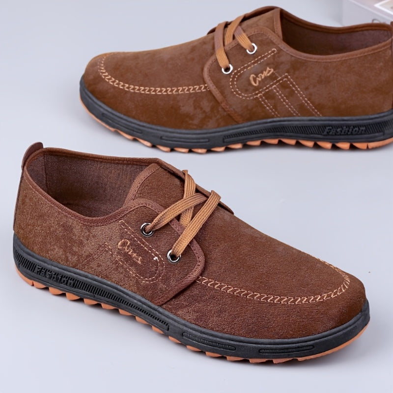 Comfortable men's slip-on canvas shoes in solid colors, ideal for outdoor activities.