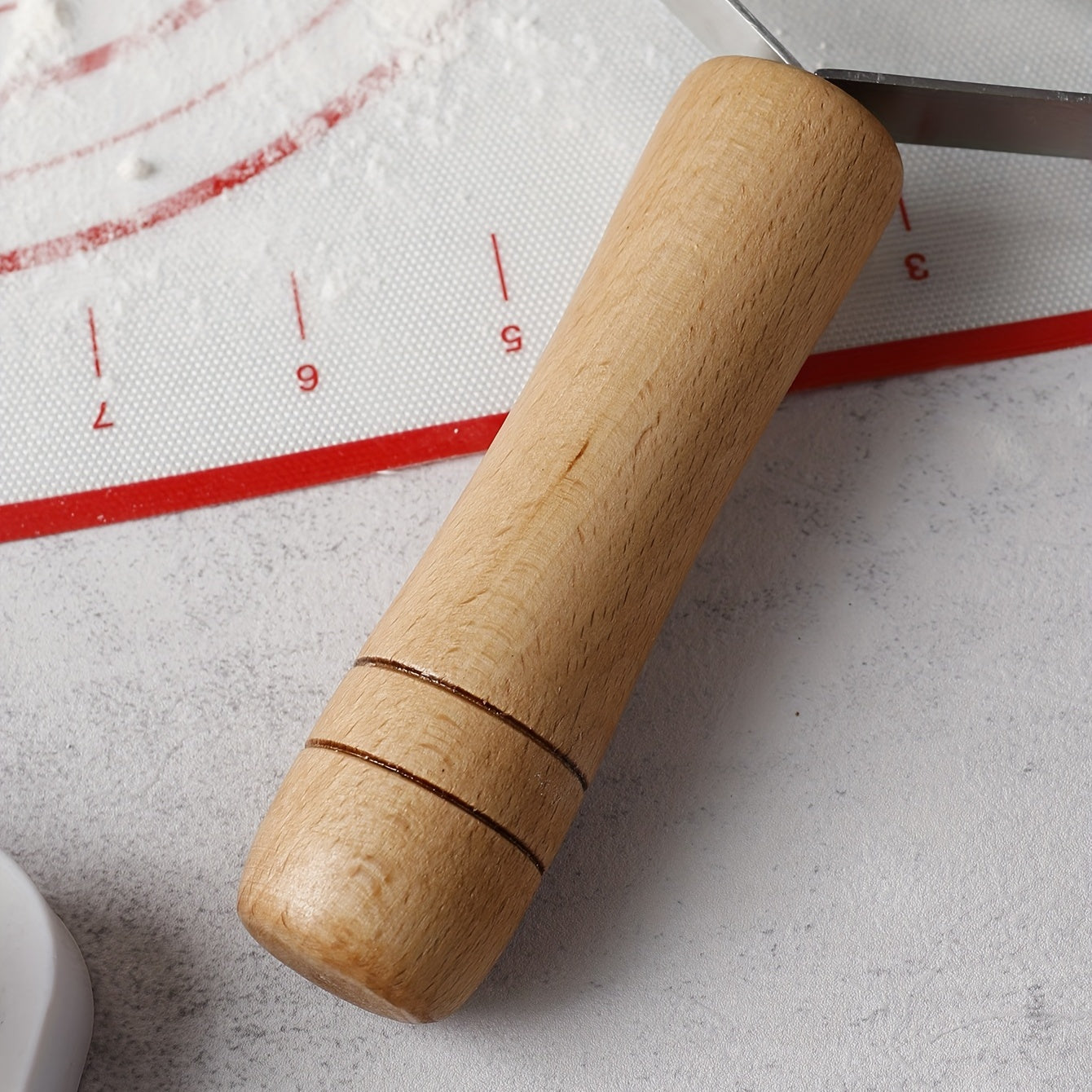 Six-wheel stainless steel cookie and noodle cutter with a wavy wood handle - Perfect for cutting cookies and noodles in the kitchen.