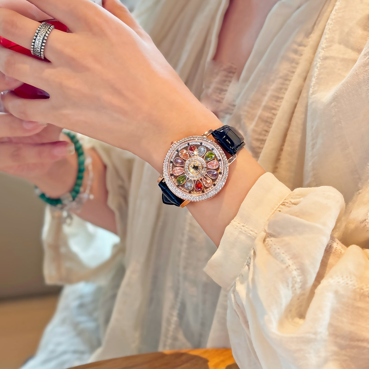 Stylish women's quartz wristwatch with colorful rhinestones, rotating dial, alloy case, and PU leather strap. Perfect for date night and everyday wear.