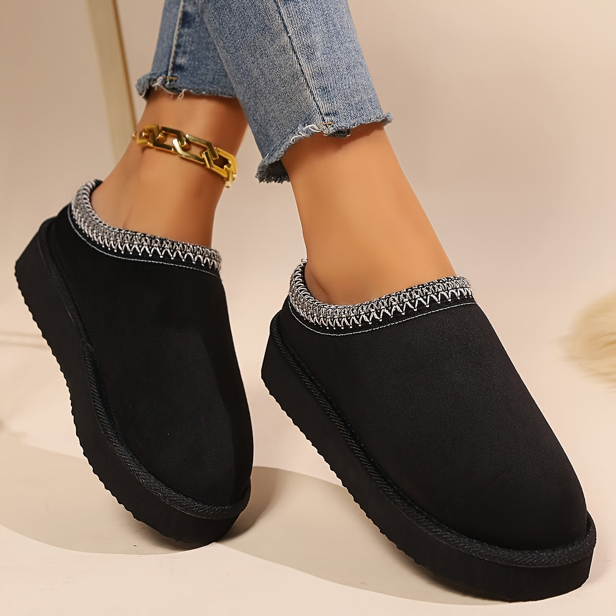 Warm and cozy women's winter slippers with plush lining and anti-slip sole.