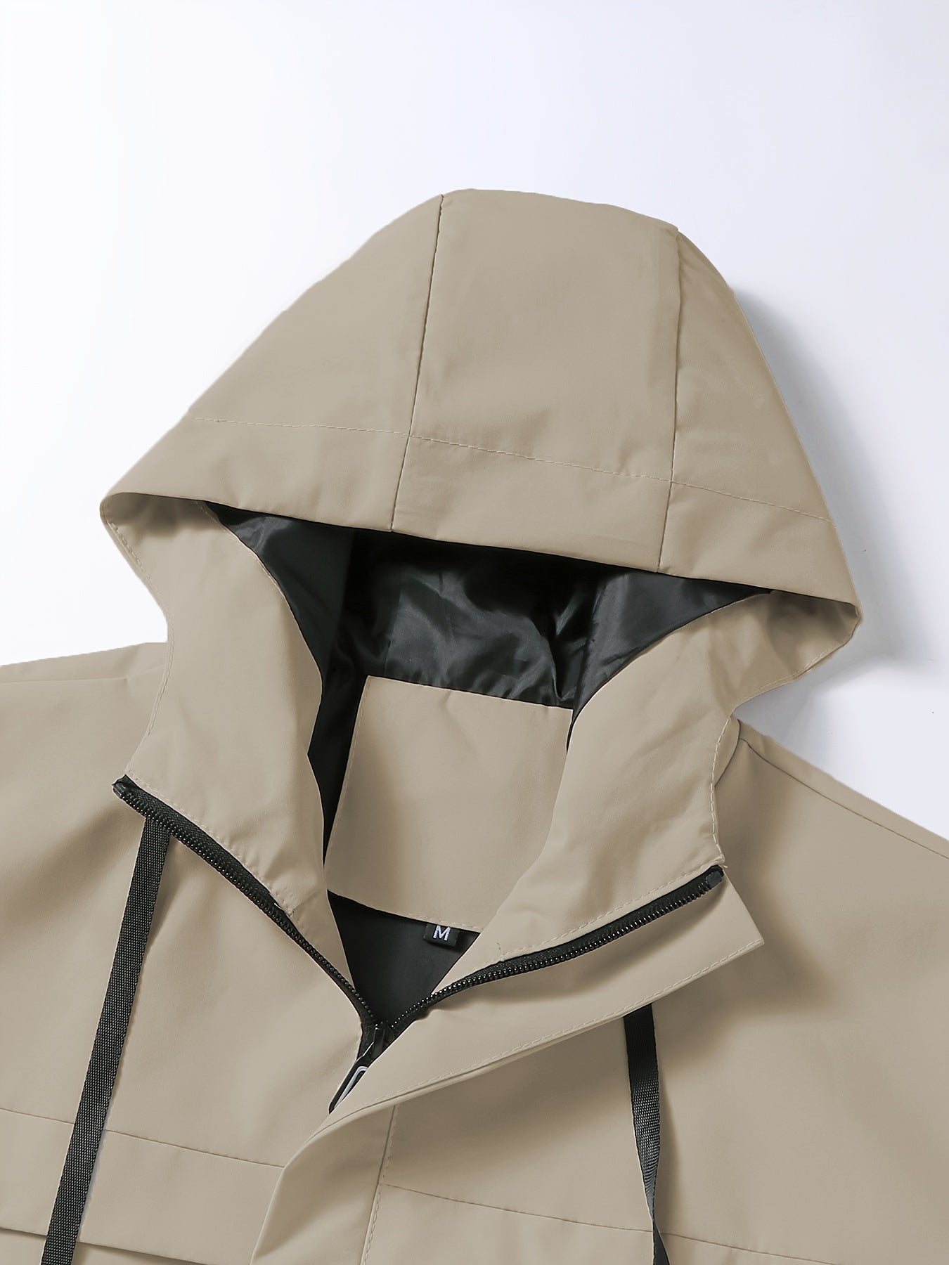 Men's hooded windbreaker jacket with zip pockets for travel and leisure.