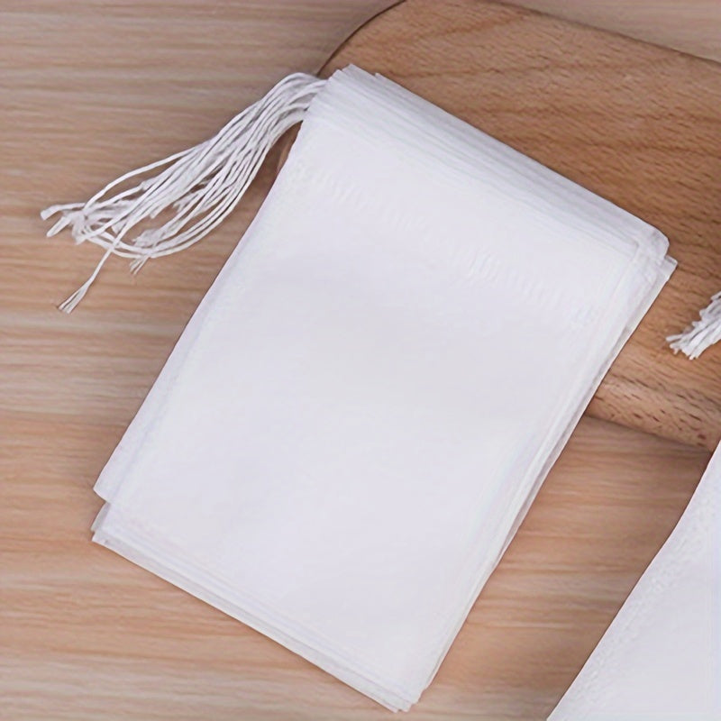 200 pieces of disposable tea bags, made of non-woven fabric and featuring a convenient drawstring closure, perfect for steeping loose leaf tea and spice sachets.