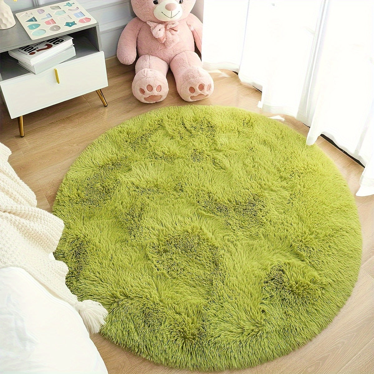 Soft and plush round area rug featuring a modern design in polyester material. Perfect for adding a cozy atmosphere to your bedroom, living room, study, or entertainment areas. Easy to clean and maintain, but recommended for dry clean only. Available in