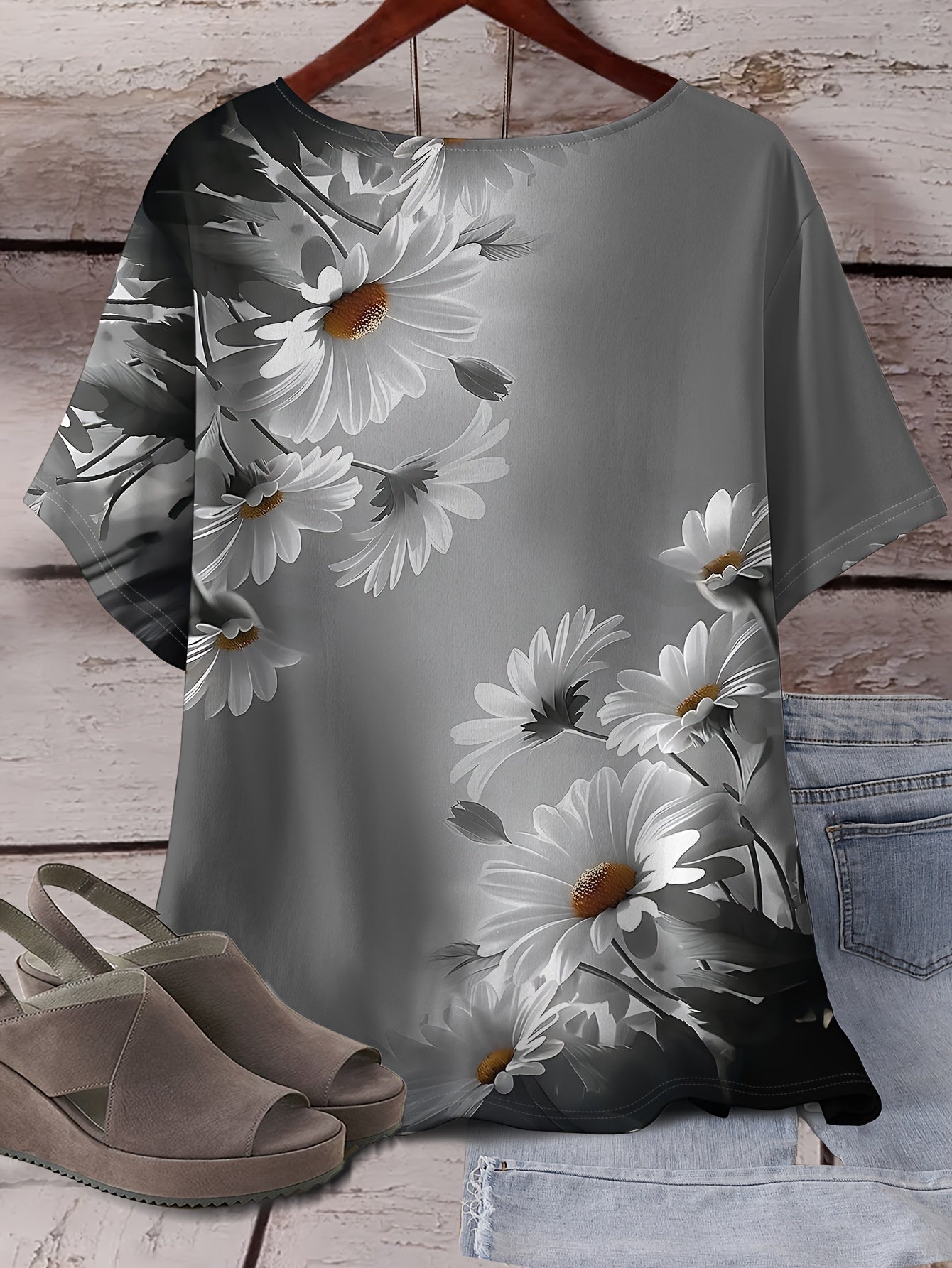 Soft, stretchy polyester blend daisy print t-shirt for plus size women in heather gray. Machine washable.