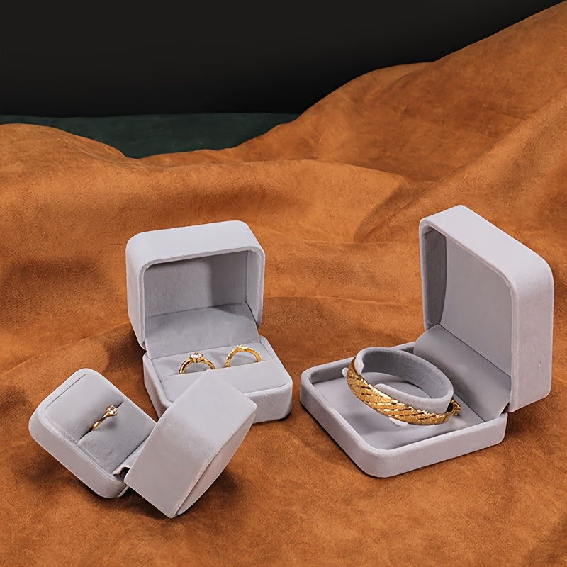 Elegant velvet jewelry box with cufflink compartment, classic design for rings, earrings, and necklaces. Soft fabric interior, available in multiple colors. Ideal gift packaging for special occasions.