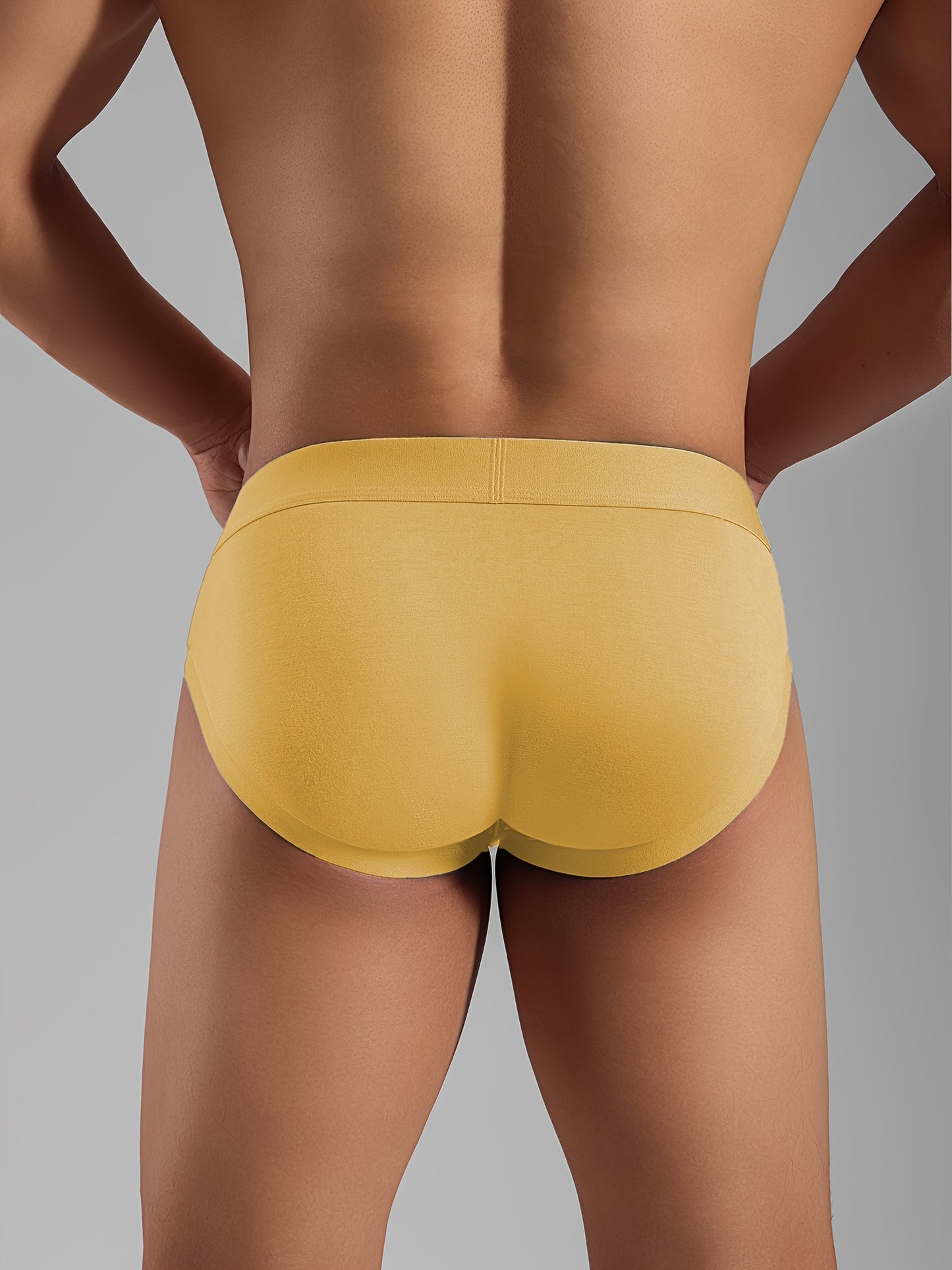 Men's low-rise briefs with large pouch, breathable comfort, high stretch, and elasticity for sports fitness.