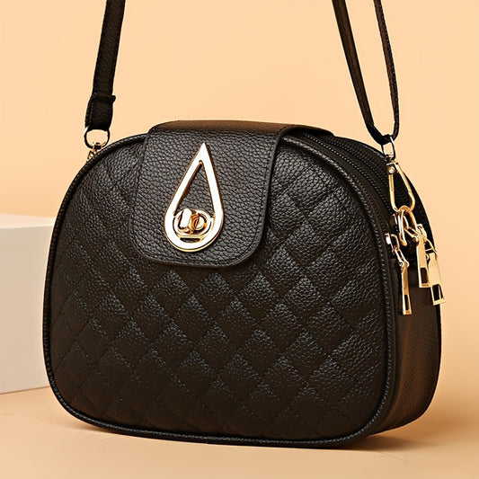 Vintage style faux leather crossbody bag in black with quilted design, adjustable strap, and phone pocket.